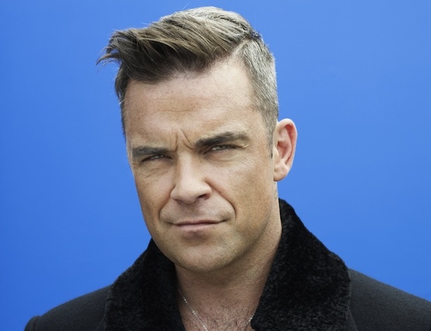 Robbie Williams va veni în România joi seară, cu un avion privat